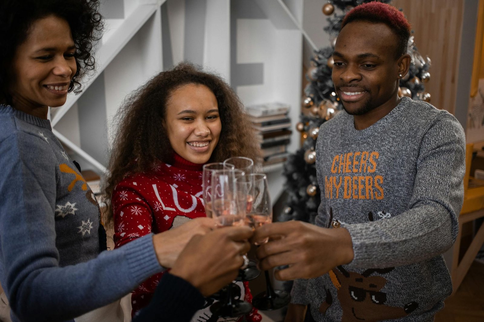 A joyful family cheers together in a festive indoor setting. Celebrating love and togetherness.